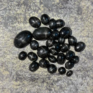 Black star ruby gemstone with visible six-rayed star effect rare dark asterism ruby stone